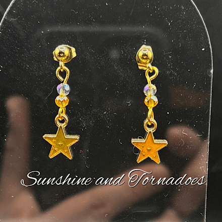 Dainty gold star earrings with tiny crystals for sparkle