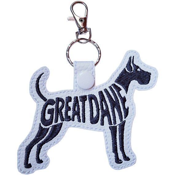 White embroidered Great Dane word art keyring made from faux leather, with stitched breed lettering and silver metal hardware.