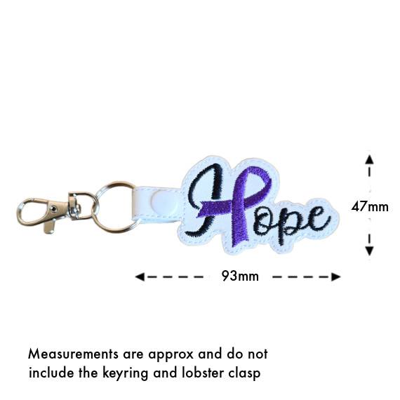 Size guide for embroidered Hope ribbon keyring, showing approximate measurements of 47mm high by 93mm wide, not including the keyring or lobster clasp.