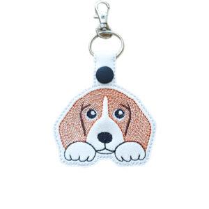 Kawaii Beagle keyring made from white faux leather, with embroidered floppy ears, paws and silver metal hardware.