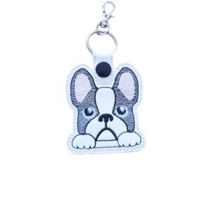 Kawaii French Bulldog keyring made from white faux leather, with embroidered big ears, sweet paws and silver metal hardware.