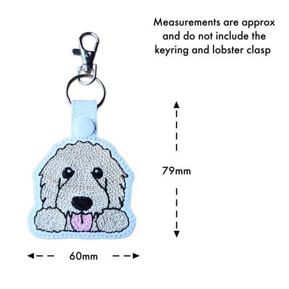 Kawaii Goldendoodle keyring with size guide showing the embroidered dog design measures approximately 79mm x 60mm, excluding the keyring and lobster clasp.