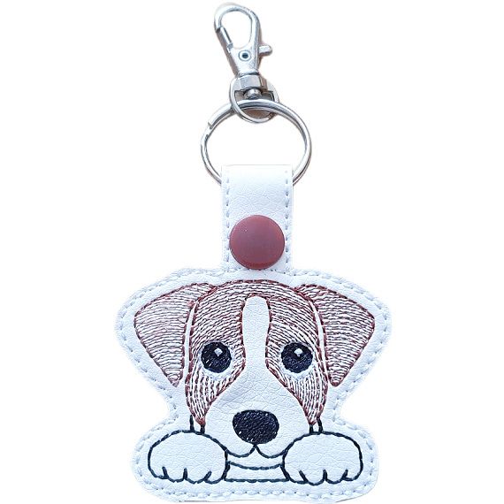 Short-haired Kawaii Jack Russell Terrier keyring in brown and white, made from faux leather with embroidered details and silver metal hardware.