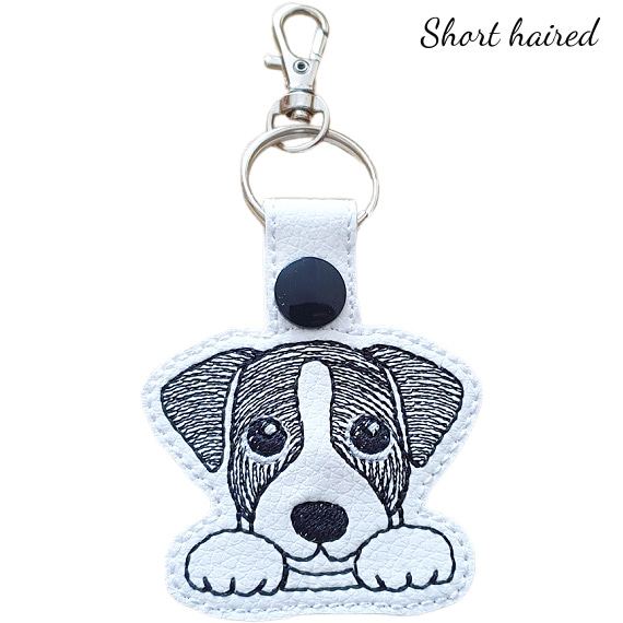 Short-haired Kawaii Jack Russell Terrier keyring in black and white, made from faux leather with embroidered details and silver metal hardware.