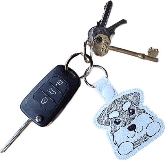 Kawaii Schnauzer keyring attached to a set of keys, showing the embroidered dog design in everyday use.