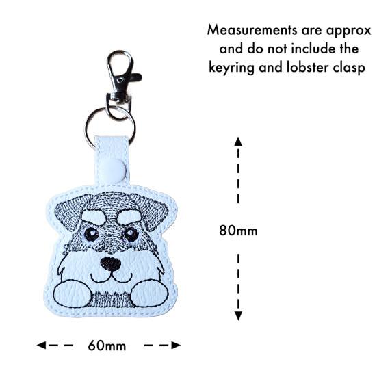 Kawaii Schnauzer keyring with size guide showing the embroidered dog design measures approximately 80mm x 60mm, excluding the keyring and lobster clasp.
