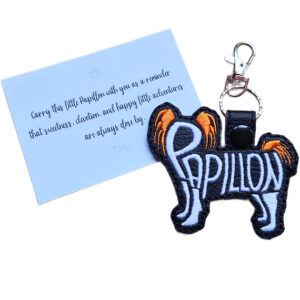 Black embroidered Papillon word art keyring shown beside its keepsake card with a sentimental dog lover message.