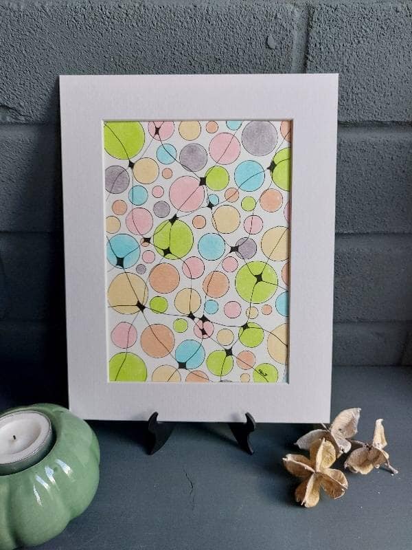Artwork depicting circles of differing sizes with neuro graphic lines connecting some