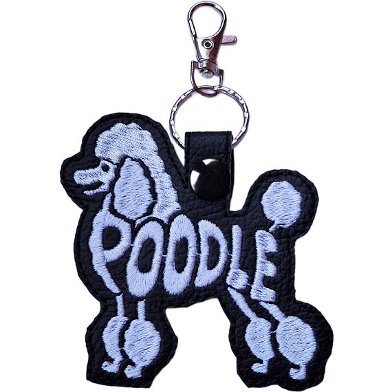 Black embroidered Poodle word art keyring made from faux leather, with stitched breed lettering and silver metal hardware.