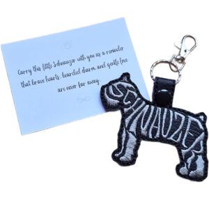 Black embroidered Schnauzer word art keyring shown beside its keepsake card with a sentimental dog lover message.