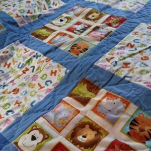 Children’s patchwork quilt. Approx 41 inches square. All proceeds to The Stroke Association