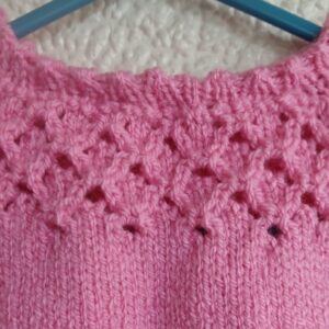 Hand-knitted baby top. Pink. Approx 0 to 3 mths. All proceeds to The Stroke Association