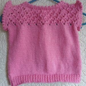 Hand-knitted baby top. Pink. Approx 0 to 3 mths. All proceeds to The Stroke Association