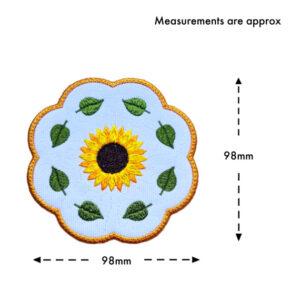 Sunflower candle coaster size guide showing the embroidered scalloped coaster measuring approximately 98mm by 98mm.