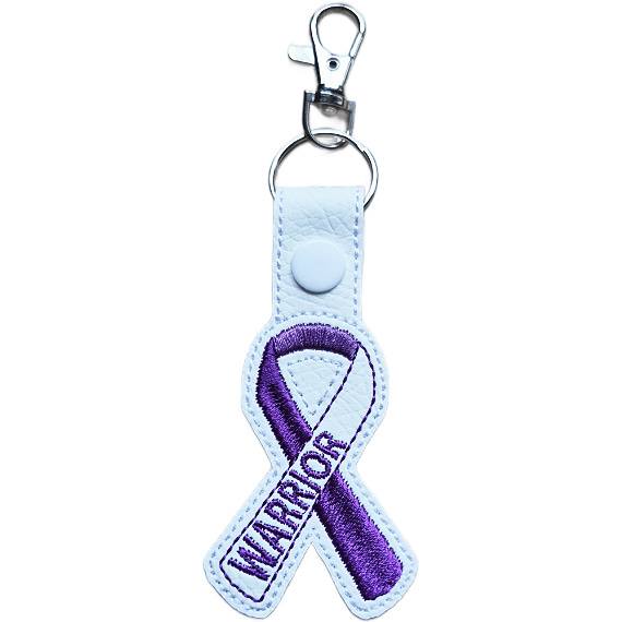 Embroidered Warrior awareness ribbon keyring made from white faux leather, featuring a purple stitched ribbon design with white snap and silver metal hardware.