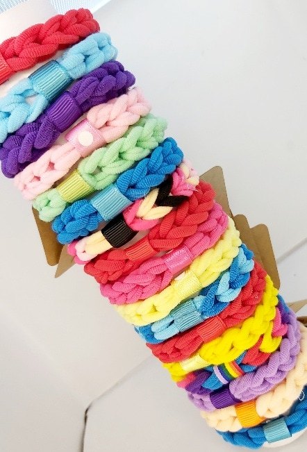 Hand-Braided Colorful Hair Bands Display - Image 2