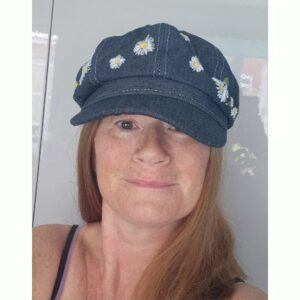 Ladies Denim Newspaper Boy Cap, hand embroidered with an array of daisies