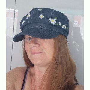 Ladies Denim Newspaper Boy Cap, hand embroidered with an array of daisies