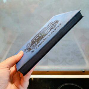Vintage Book Decor: Polished & Painted with Vinyl for a Quirky Bookshelf
