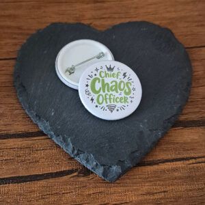 Funny chaos badge design with the phrase 'Chief chaos officer' in playful lettering, decorated with starburst and sparkle accents.