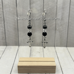 Handmade gemstone earrings featuring matte black obsidian beads, polished hematite beads, sparkling Czech crystal beads and detailed silver-tone cross charms suspended from stainless steel ear wires.