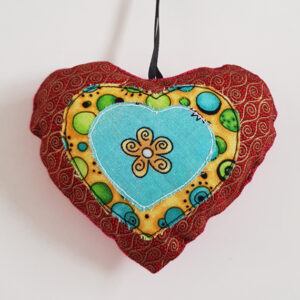 Handmade Fabric Hanging Heart Decoration - Double-Sided Star And Patchwork Design on a white background