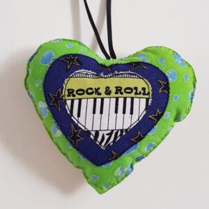 Handmade Fabric Hanging Heart Decoration With Rock And Roll Piano on the front shown here on a white background