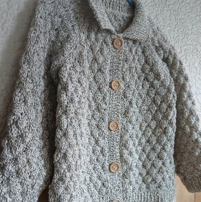 Hand-knitted child's cardigan. Approx 2 to 3 years. Proceeds to Charity