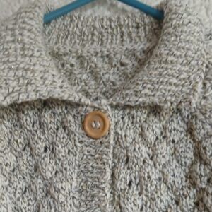 Hand-knitted child’s cardigan. Approx 2 to 3 years. Proceeds to Charity