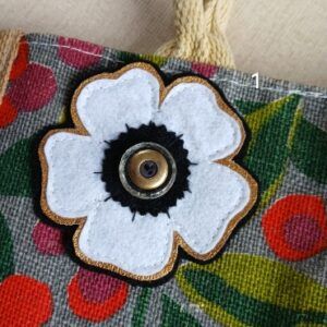 Floral brooch pin accessories. White and gold with vintage button centre.