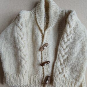 Hand-knitted baby Aran wool jumper. Approx 0 to 3 mths. Proceeds to Charity