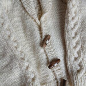 Hand-knitted baby Aran wool jumper. Approx 0 to 3 mths. Proceeds to Charity