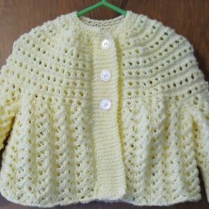 Hand- knitted baby cardigan in lemon. Approx 3 to 6 mths. All proceeds to The Stroke Association