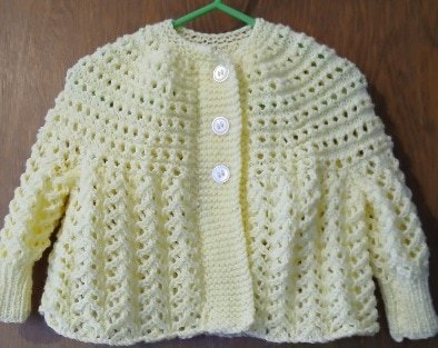 Hand- knitted baby cardigan in lemon. Approx 3 to 6 mths. All proceeds to The Stroke Association