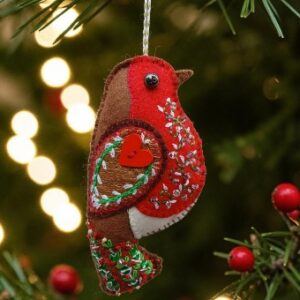 The robin. A symbol of hope, remembrance and fresh beginnings. A hand embroidered decoration. All proceeds to The Stroke Association.
