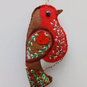 The robin. A symbol of hope, remembrance and fresh beginnings. A hand embroidered decoration. All proceeds to The Stroke Association.