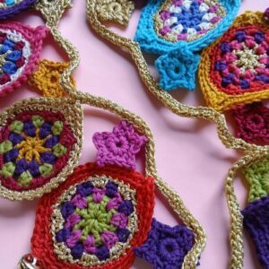 Festive party garland with glits, bells and pzazz. Gold crocheted. Proceeds to The Stroke Association.