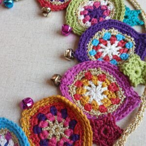 Festive party garland with glits, bells and pzazz. Gold crocheted. Proceeds to The Stroke Association.