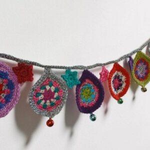Festive party garland with glits, bells and pzazz. Silver crocheted. Proceeds to The Stroke Association.