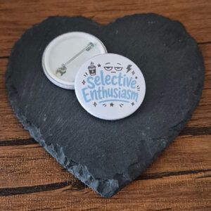 Funny mood badge design with the phrase 'Selective enthusiasm' in playful lettering, decorated with small star accents and an unimpressed face detail.