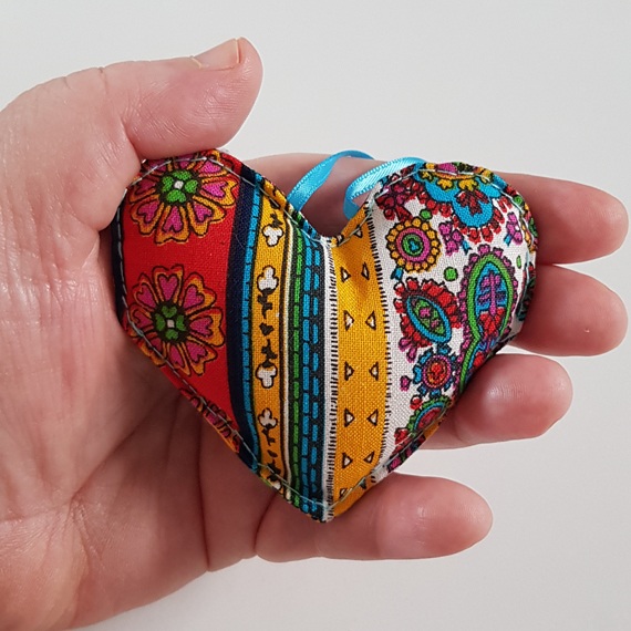 Bright Multicoloured Vintage Floral Hanging Heart Decoration On A White Background