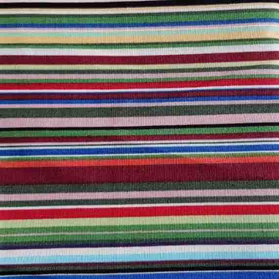 Bright multicoloured striped fabric with green, red, blue, cream and pink horizontal stripe pattern.