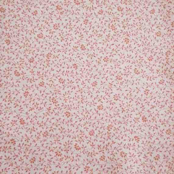 Cream fabric with delicate pink flowers, tiny leaves and a subtle trailing floral pattern.