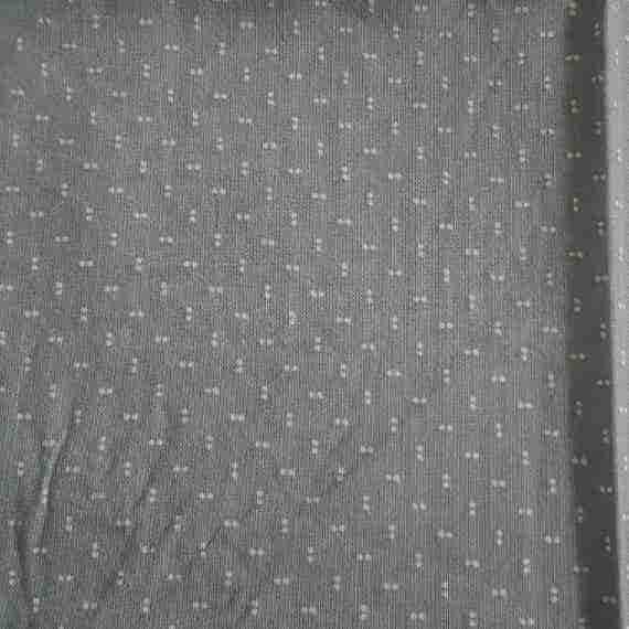 Soft grey fabric with small cream double dots and a subtle minimalist dotted pattern.