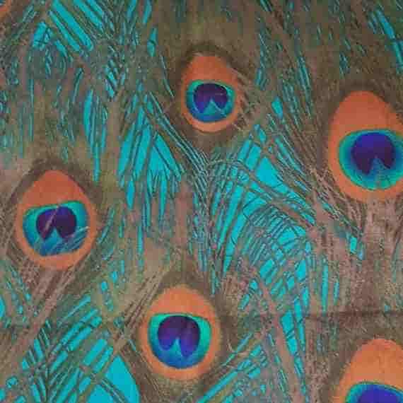 Colourful peacock feather fabric with teal, green, orange and blue eye details.