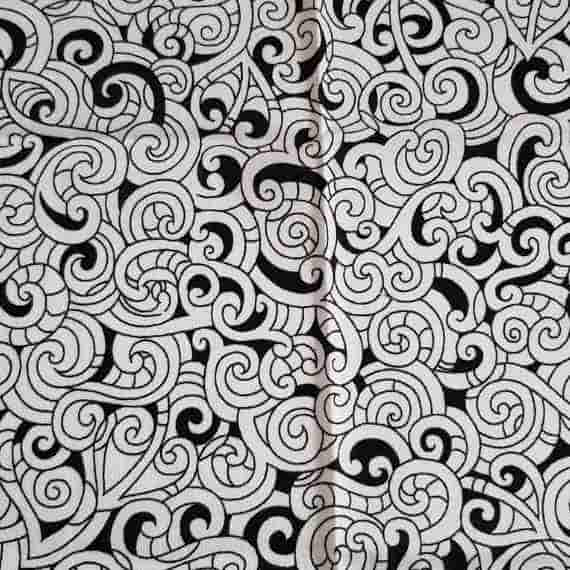 Monochrome fabric with black and white abstract swirls, scrolls and decorative line details.