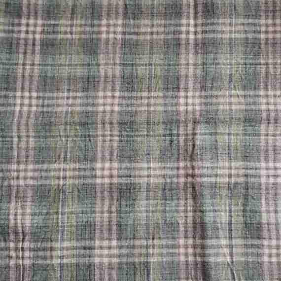 Muted green tartan fabric with grey, cream and brown checks in a soft woven plaid pattern.