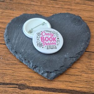 Low Effort Legend funny mood badge with playful red lettering, small sparkle details and cheerful little accents, available as a badge, magnet or keyring.