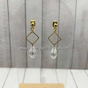 Handmade gold geometric earrings featuring elegant diamond-shaped frames and faceted crystal drop pendants, creating lightweight contemporary jewellery with a sophisticated sparkle for special occasions and everyday wear.