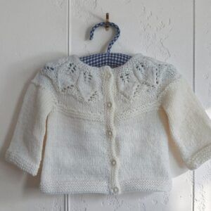Hand- knitted baby jumper. Approx 0 to 3 mths. 50% wool.All proceeds to The Stroke Association